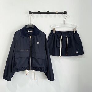 Miu Miu workwear jacket, trousers with low waist pockets, and short skirt set